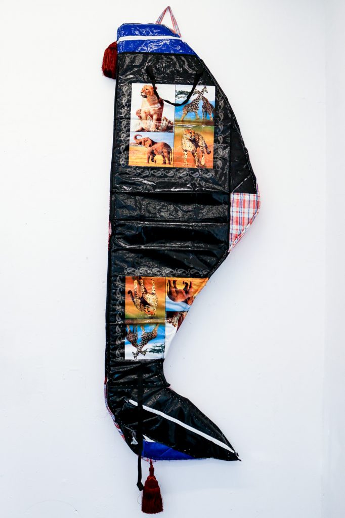 Layo Bright, Must Go (Safari Tour), 2018, 27 x 80 inches, Ghana-Must-Go Bag, Rope, Tassels