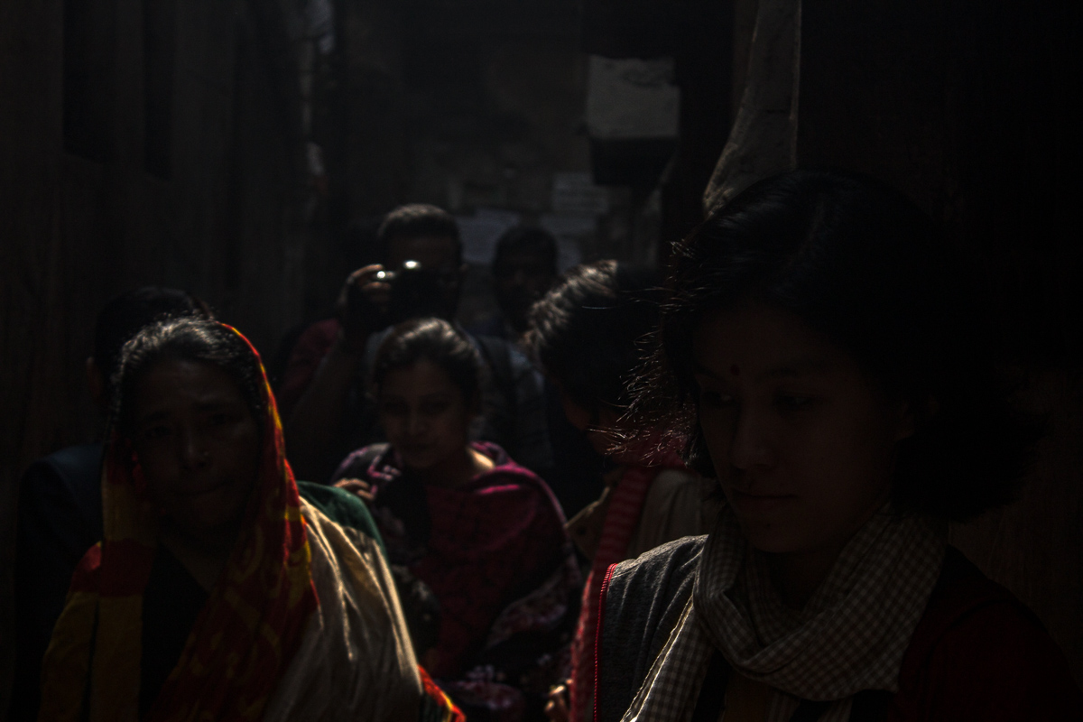 Image: Dark Alley. Photo of women in a dark alley.
